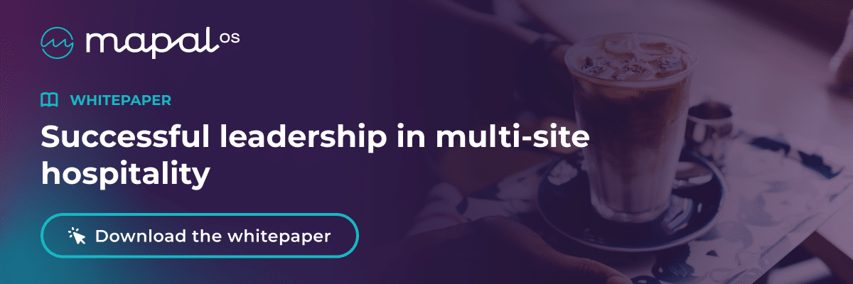 A person holding a tray with a latte, next to text promoting a whitepaper: Successful leadership in multi-site hospitality. There's a button reading Download the whitepaper.