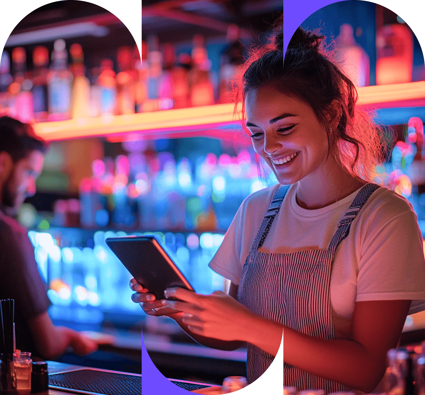 A smiling barman in a striped apron looks at a tablet behind a brightly lit bar to help restaurants drive growth and profitability.
