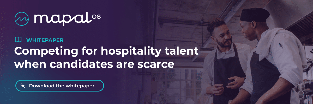 Two men in a professional kitchen talk and smile. Text reads: Competing for hospitality talent when candidates are scarce. A button below says, Download the white paper.