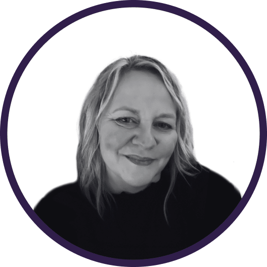 A greyscale portrait of a woman with fair hair and a slight smile, wearing a dark top. The image is framed by a purple circle on a white background.